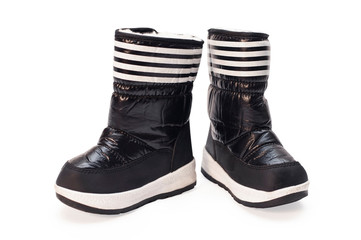 Black boots for children are isolated on a white background. In these boots the child will be warm in the winter