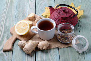 Obraz na płótnie Canvas Tea with ginger and lemon on the table