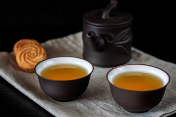 Chinese brown teapot and cups for tea