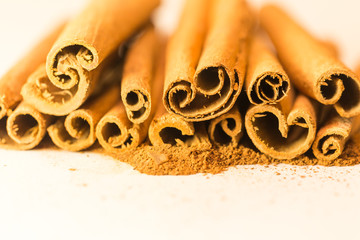 cinnamon sticks and powder isolated