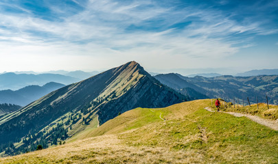 nice senior woman, hiking in fall, autumn  on the ridge of the Nagelfluh chain near Oberstaufen,...