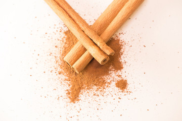 cinnamon sticks and powder isolated