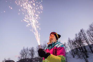 Woman holding a sparkler fireworks