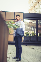 Young businessman reading his notebook