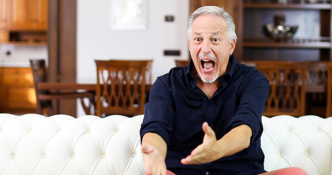 Senor Guy Watching Sports In Tv And Shouting