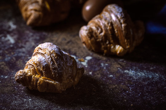 freshly baked buns with almonds. Croissants and brioches