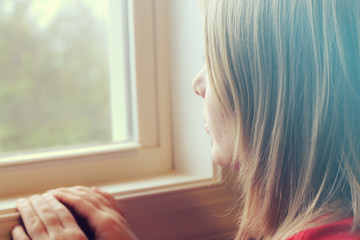 Young Woman Staring Outside the Window