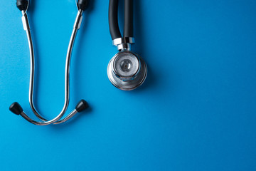 Medical stethoscope on blue background