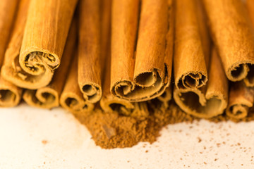 cinnamon sticks and powder isolated