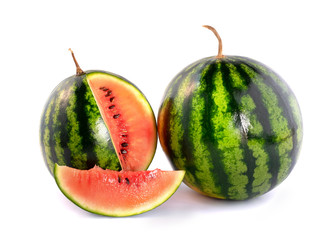 Two ripe little watermelons sliced isolated on white background.