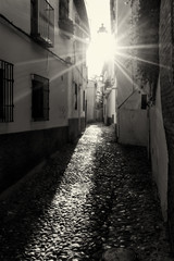 Obraz premium Romantic alleys of Granada, Spain at sunset