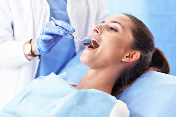 Adult woman having a visit at the dentist's