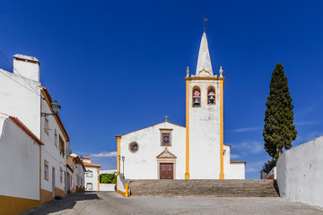 Igreja de Nossa Senhora da Conceicao Church. Mother Church of Crato with typical white washed walls and ochre or yellow color. Alto Alentejo, Portugal