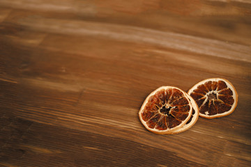dried lemon slices on a wooden background .Copy space