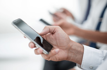 close up.modern smartphone in the hand of a businessman.