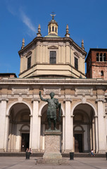 Facade of San Lorenzo Maggiore Basilica -Saint Lawrence the Major Cathedral- and statue of Constantine emperror in front.