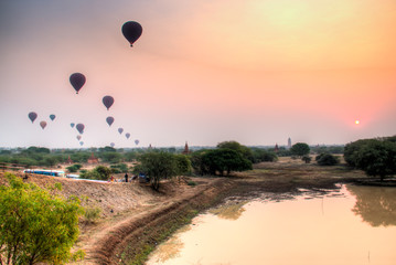 Hot air balloons rise over the plains of Bagan, a historical site in Myanmar, in the early morning

