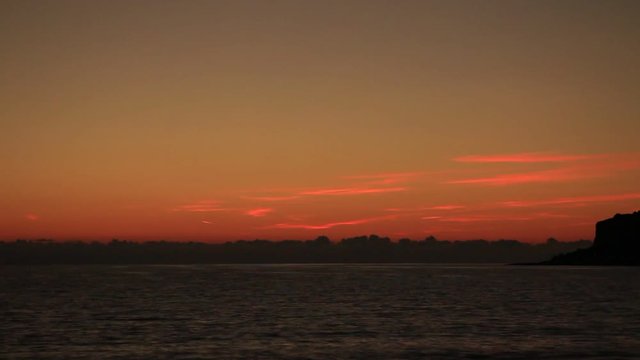 Scenic sunset over sea surface. Greece Peloponnese Lakonias Neo Itylo. Time lapse