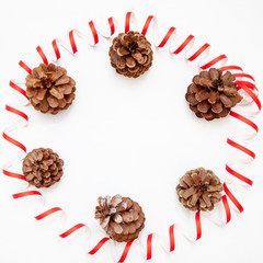 red Christmas toys, decoration,pinecone. Glitter. Isolated on white background. Round frame