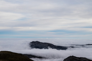 landscape of mountains at sunrise above the clouds, sea of clouds