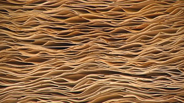 Production technology of plywood at the plant. Prepared veneer sheets. Furniture factory. Production of plywood. Automated production of plywood sheets.  Veneer bundles.
