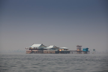 Houses at the shore of Inle Lake, one of the top tourist attractions of Myanmar
