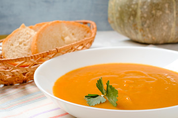 Delicious Pumpkin cream soup on table, top view, close-up
