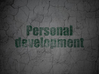 Learning concept: Green Personal Development on grunge textured concrete wall background