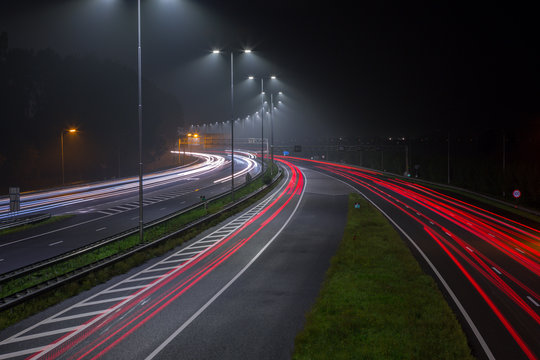 Red tail lights on the A2 highway at night out of Amsterdam in the Netherlands.