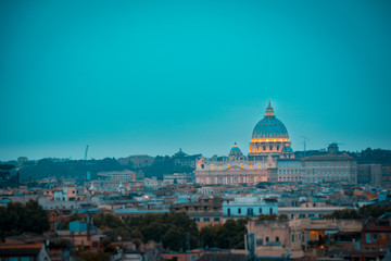 Fototapeta na wymiar St. Peter's cathedral in Rome, Italy at blue hour. Orange and teal mood.