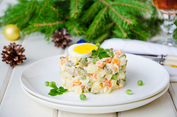 Russian traditional salad Olivier with vegetables and meat for New Year and Christmas.