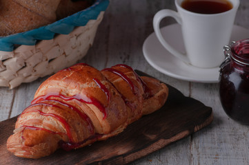 still life of croissants with coffee and jam