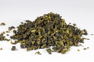 heap of green tea isolated on white background