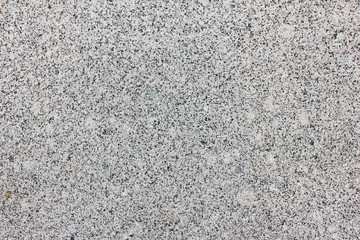 Granite Texture Close Up View of Light Grey and White Mineral Stone. Simple Stoned Surface of Natural Granite Material Background. Abstract Empty Seamless Pale Backdrop Top View with Empty Copy Space