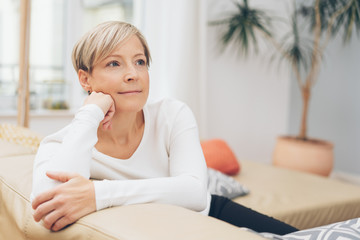 Fototapeta premium Lonely woman sitting daydreaming