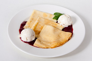 Thin pancakes with ice cream