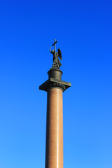 Alexander Column at Palace Square in Saint Petersburg, Russia. with Bronze Statue of an Angel Holding a Cross on Top. Focal Point of Palace Square, Symbol of Russian Victory in War with Napoleon Army