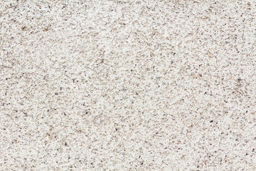 Texture gray granite. Smooth light stone texture. Beige colors.  Gray stone with dark inclusions.