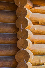 Corner of blockhouse from logs. Texture of logs from the wooden house