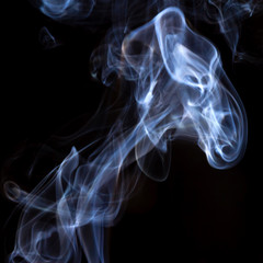 Thick smoke on a black isolated background. Background from the smoke of vape