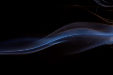 Thick smoke on a black isolated background. Background from the smoke of vape