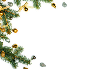 Christmas background with golden balls and fir branches isolated on white