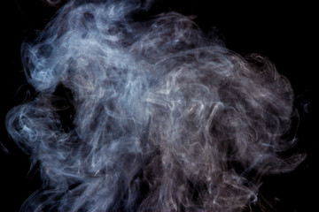 Thick smoke on a black isolated background. Background from the smoke of vape