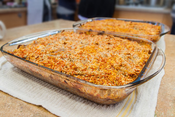 Two Large Glass Casserole Dishes of Baked Pasta and Cheese Gratin Casserole