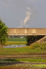 Fototapeta na wymiar Concrete Railway Overpass Across A River