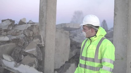 portrait of a rescue service worker walking after an earthquake