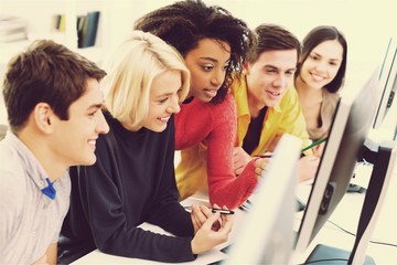 Group of Students with computer at lesson