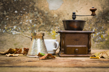 Old coffee mill on a wooden table