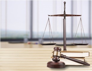 Justice Scales and books and wooden gavel