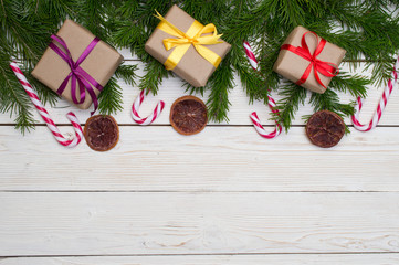 Fototapeta na wymiar Christmas fir tree on wooden background with space for your text